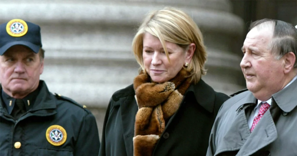 martha stewart being escorted by police officers